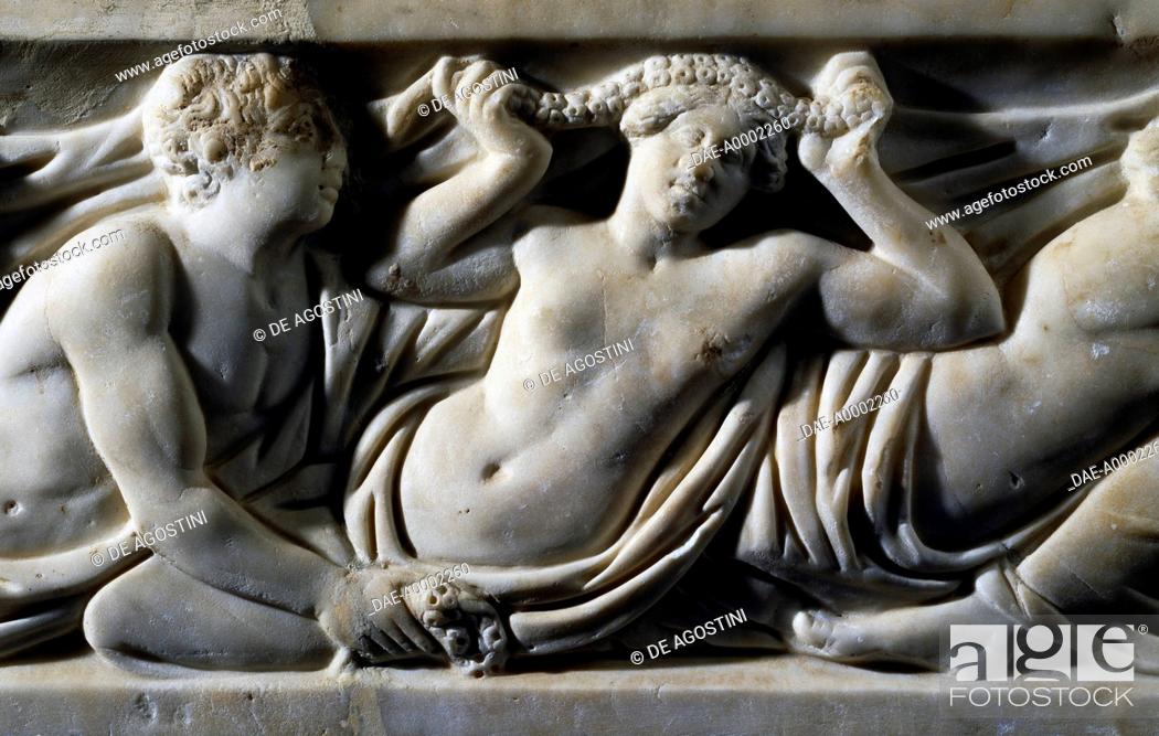 Stock Photo: Woman putting a garland of flowers on her head, detail from a marble sarcophagus with a relief depicting the Legend of Triptolemus, uncovered in Rome, Italy.