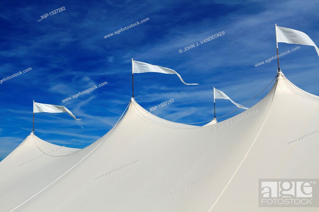 Stock Photo: The top of a large white event tent in front of a blue sky  On the beach in Long Branch, New Jersey, USA.