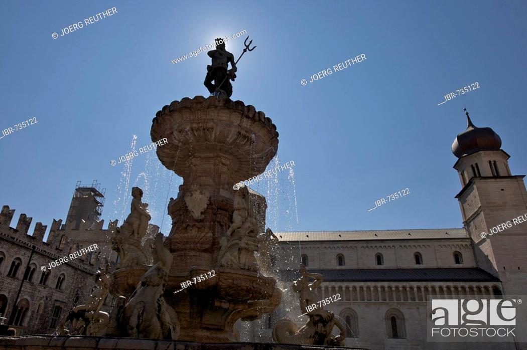 Stock Photo: Neptune Fountain backlit on the cathedral square in Trento, Northern Italy, Europe.
