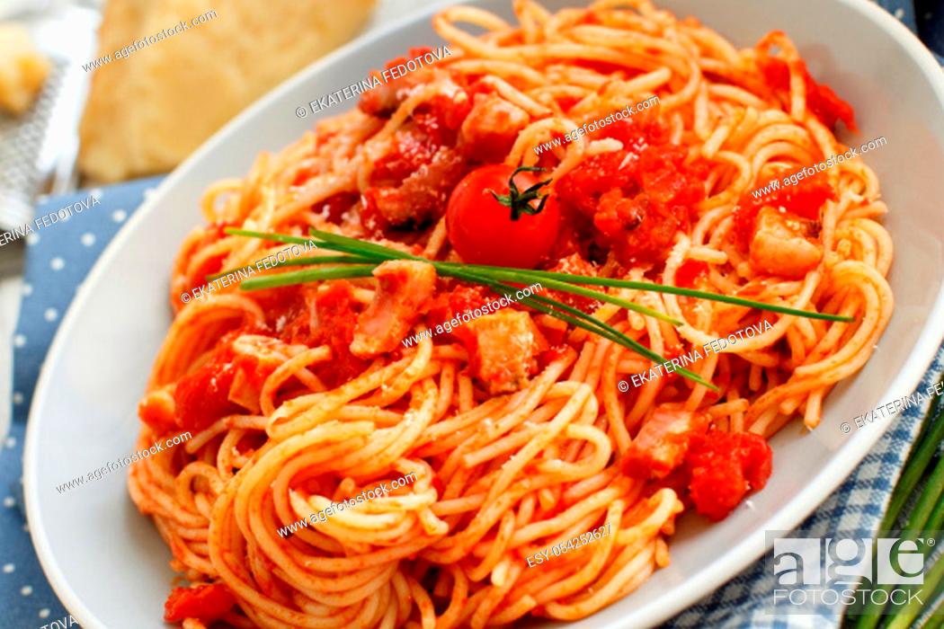 Stock Photo: Spaghetti alla amatriciana on a wooden table top view.
