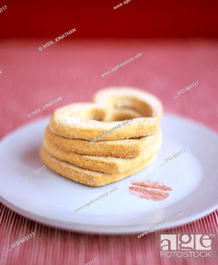Stock Photo: Heart-shaped biscuits and lipstick mark on plate.