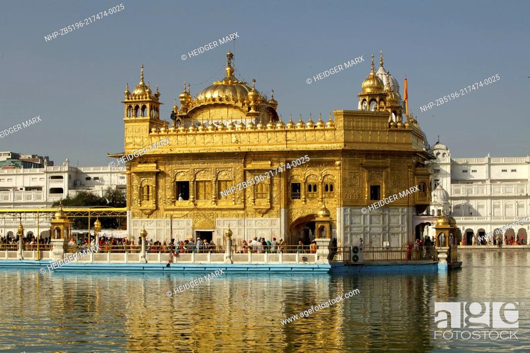 Stock Photo: The Golden Temple Hari Mandir Sahib in the middle of the Sacred Pool Amrit Sarovar Pool of Nectar.