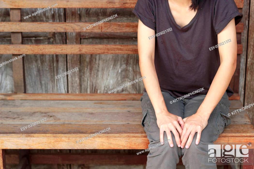 Stock Photo: Asian woman waiting some on wooden wall background.