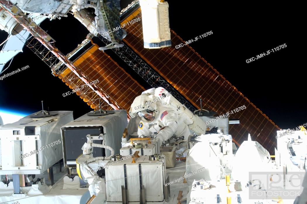 Stock Photo: Astronaut Christopher Cassidy, STS-127 mission specialist, is pictured in the center of this wide shot photographed during Endeavour's third space walk of a.