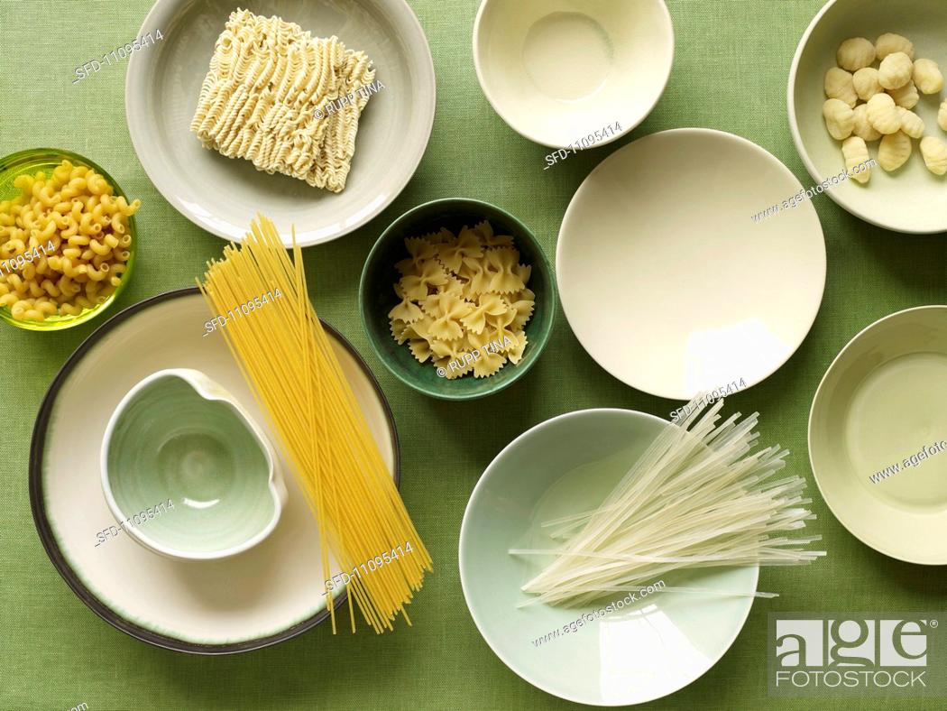 Stock Photo: Variety of Dried Pastas and Bowls, From Above.