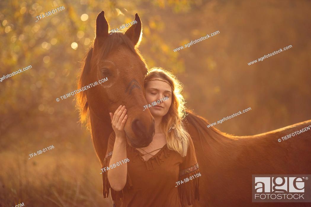 Stock Photo: Indian woman with horse.