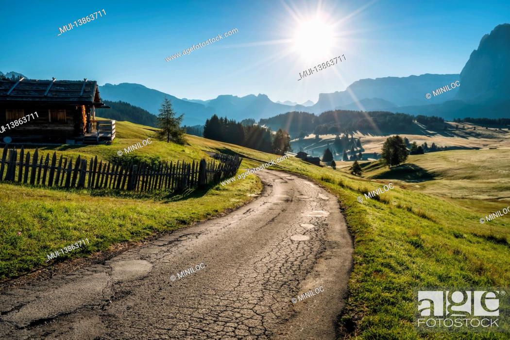 Stock Photo: Morning landscape of Alpe di Siusi plateau road, Dolomites mountains, Italy.