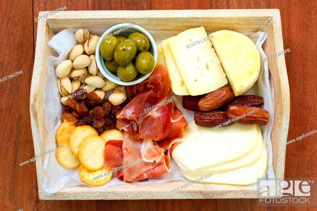 Stock Photo: cheese with prosciutto, cookies, olives.