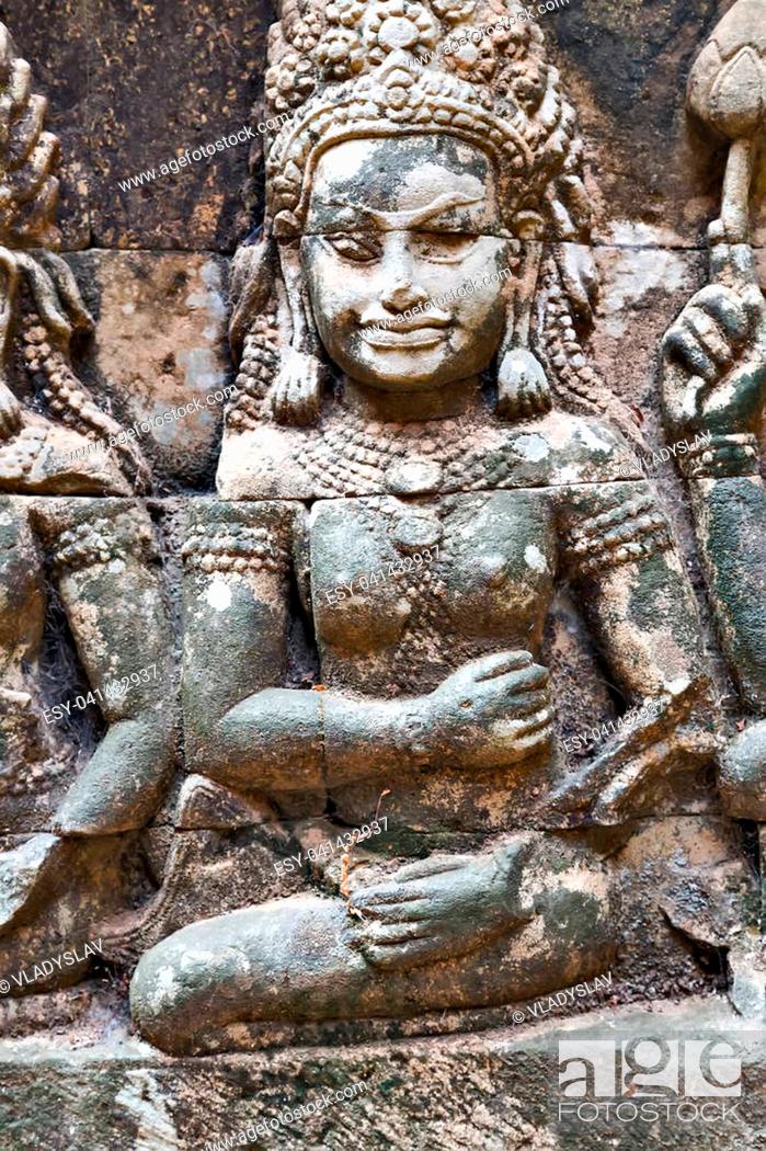 Stock Photo: Dancing Apsara Decoration Stone Carving on the wall of Angkor wat, Seam Reap, Cambodia.