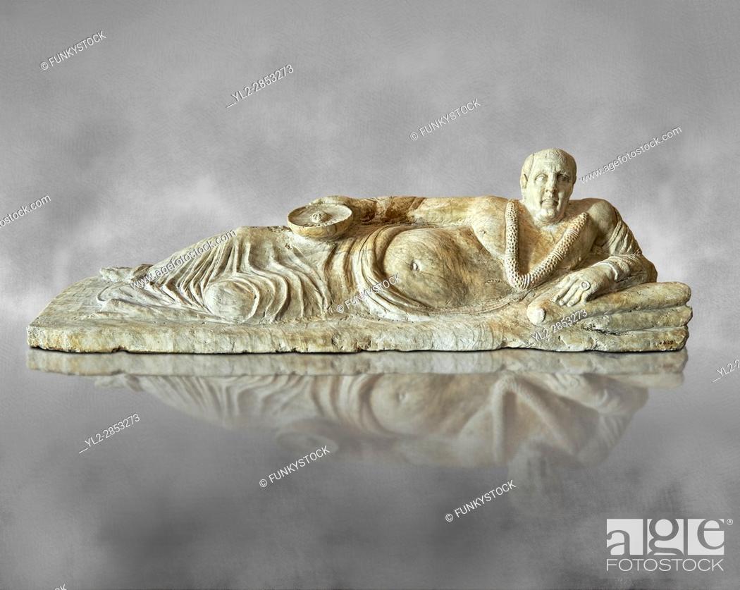 Stock Photo: Etruscan Hellenistic style cinerary, funreary, urn cover with a man, National Archaeological Museum Florence, Italy , grey art background.