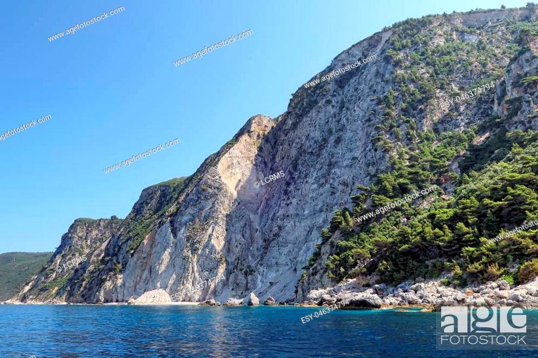 Stock Photo: paradise beach part names Chomi Beach of Liapades at Corfu Island (Greece). Sedimentary rock cliff of chalk rocks.