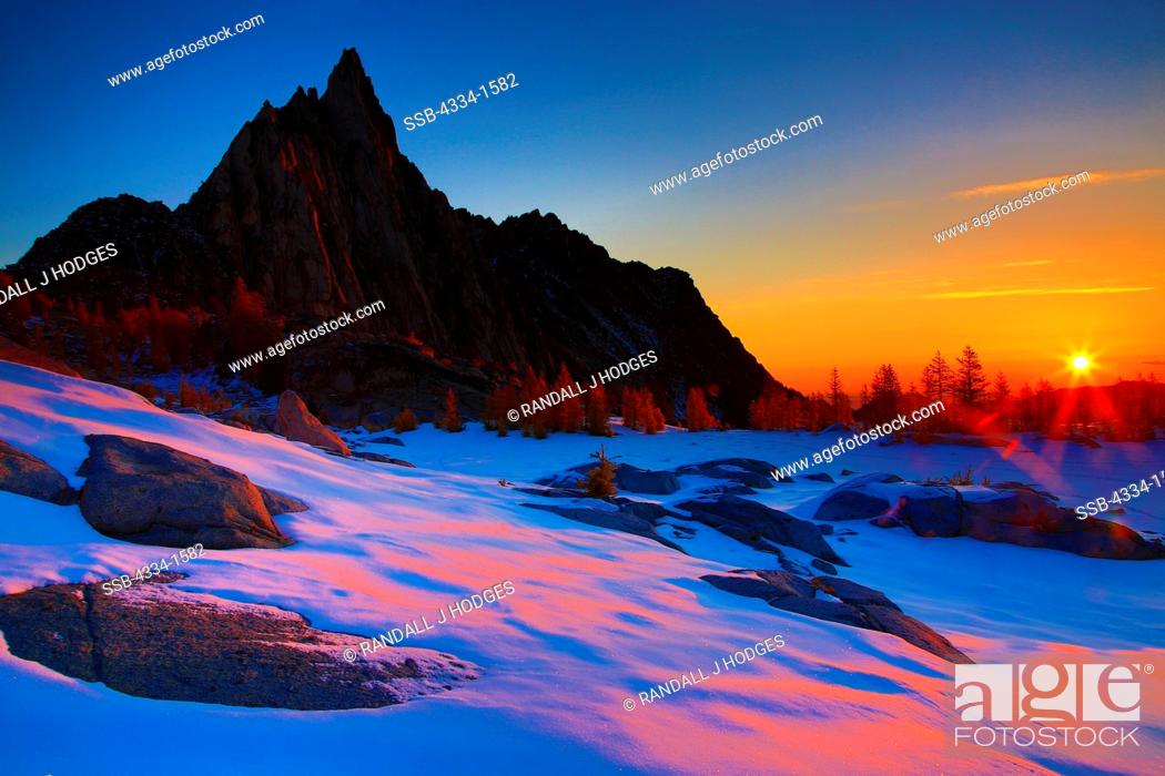 Stock Photo: Sunrise over frozen over Gnome Tarn, Prusik Peak, Alpine Lakes Wilderness, Washington State, USA.