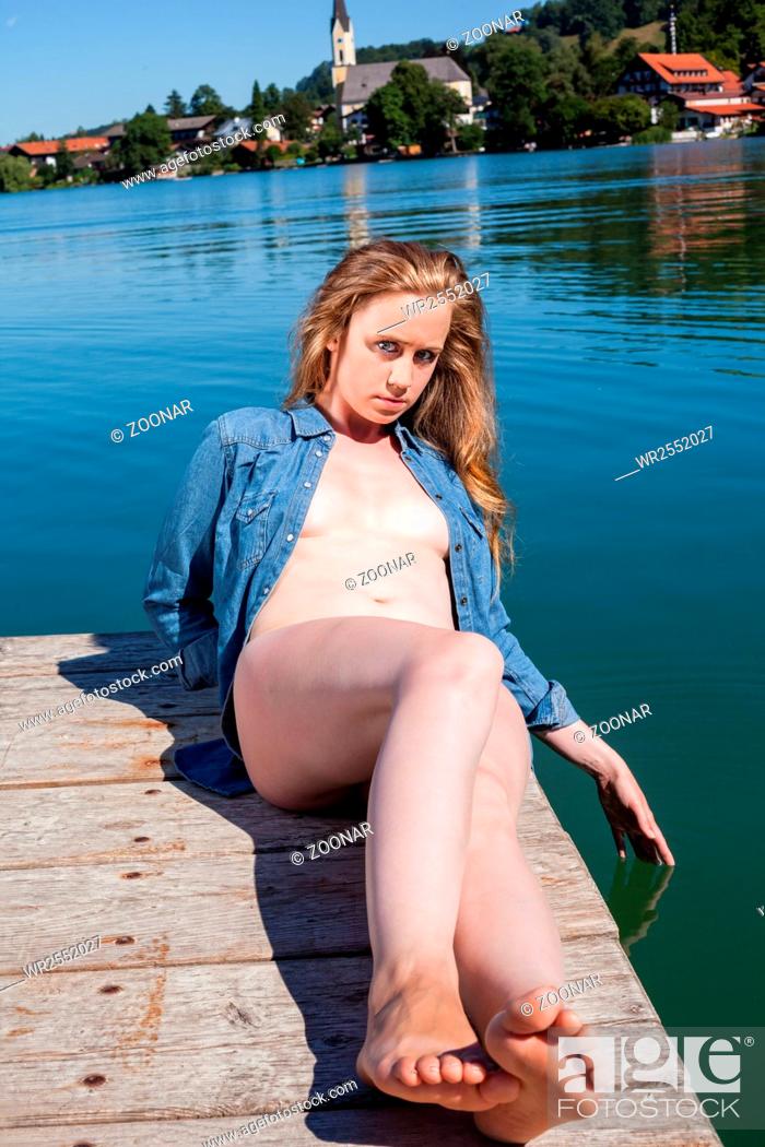Young Woman Sunbathing Nude on Lake Dock, Stock Photo, Picture And Royalty Free Image