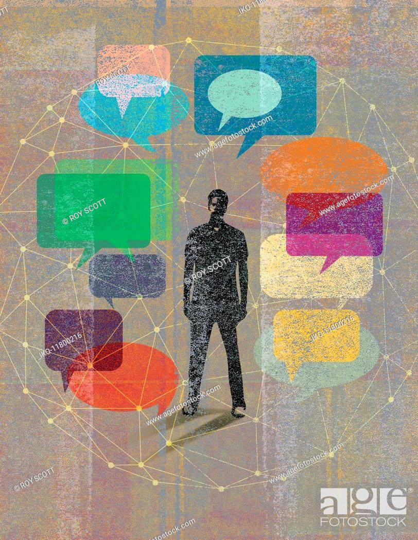 Stock Photo: Young man surrounded by network of speech bubbles.