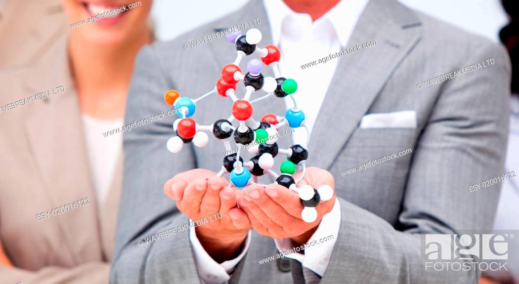 Stock Photo: Close-up of a businessman holding a molecule.