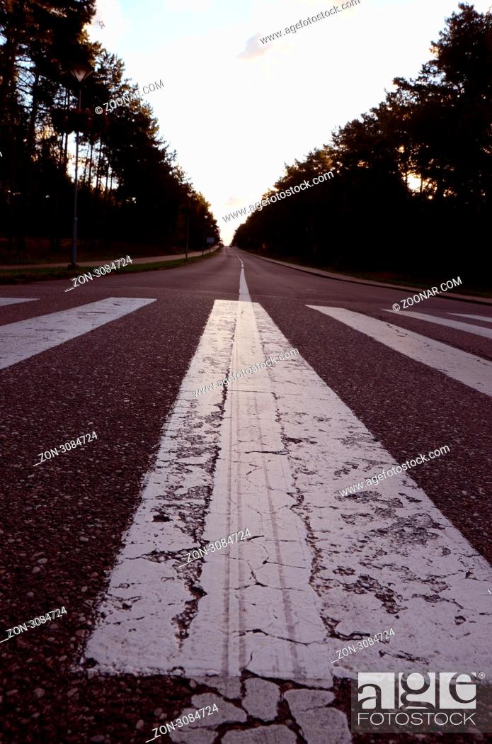 Stock Photo: Asplhalt road pedestrian crossings and markings deviding road.