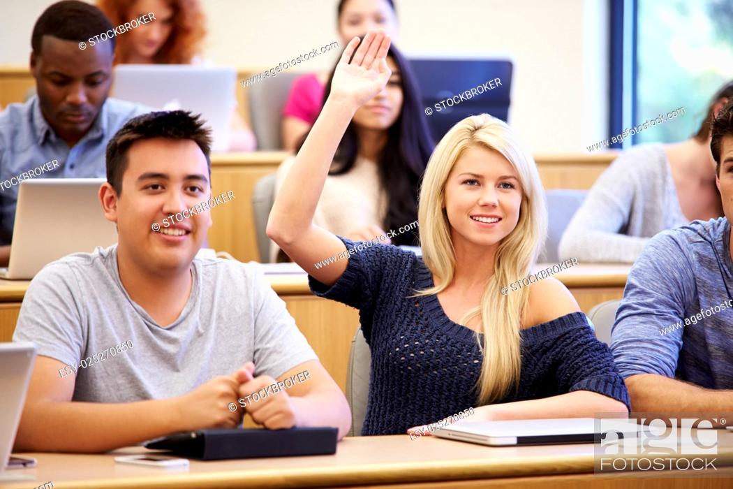Stock Photo: Students Using Laptops And Digital Tablets In Lecture.