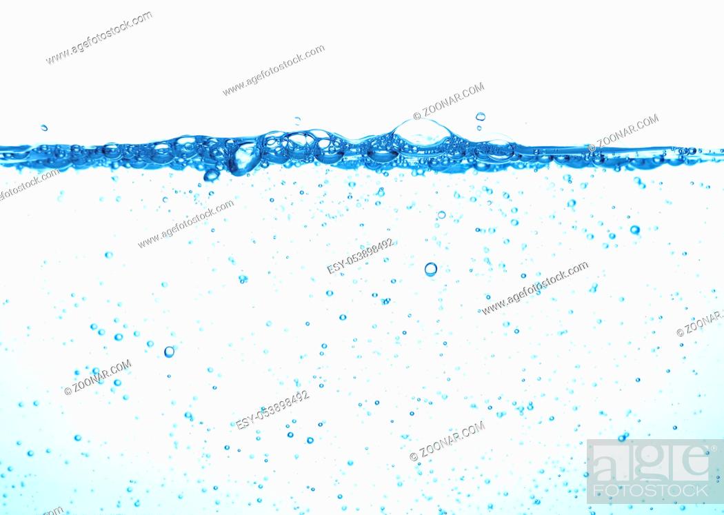 Imagen: Close up water surface splashing with bubbles and drops isolated on white background, low angle underwater view.