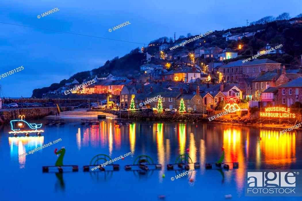 Stock Photo: Beautiful display of Christmas Lights at Mousehole Harbour Cornwall England UK Europe.