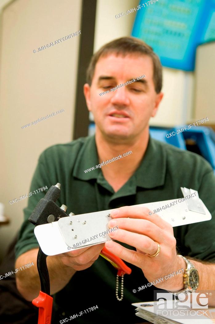Stock Photo: NASA astronaut Rex Walheim, STS-135 mission specialist, participates in a tools and repair kits training session in the Space Vehicle Mock-up Facility at NASA's.