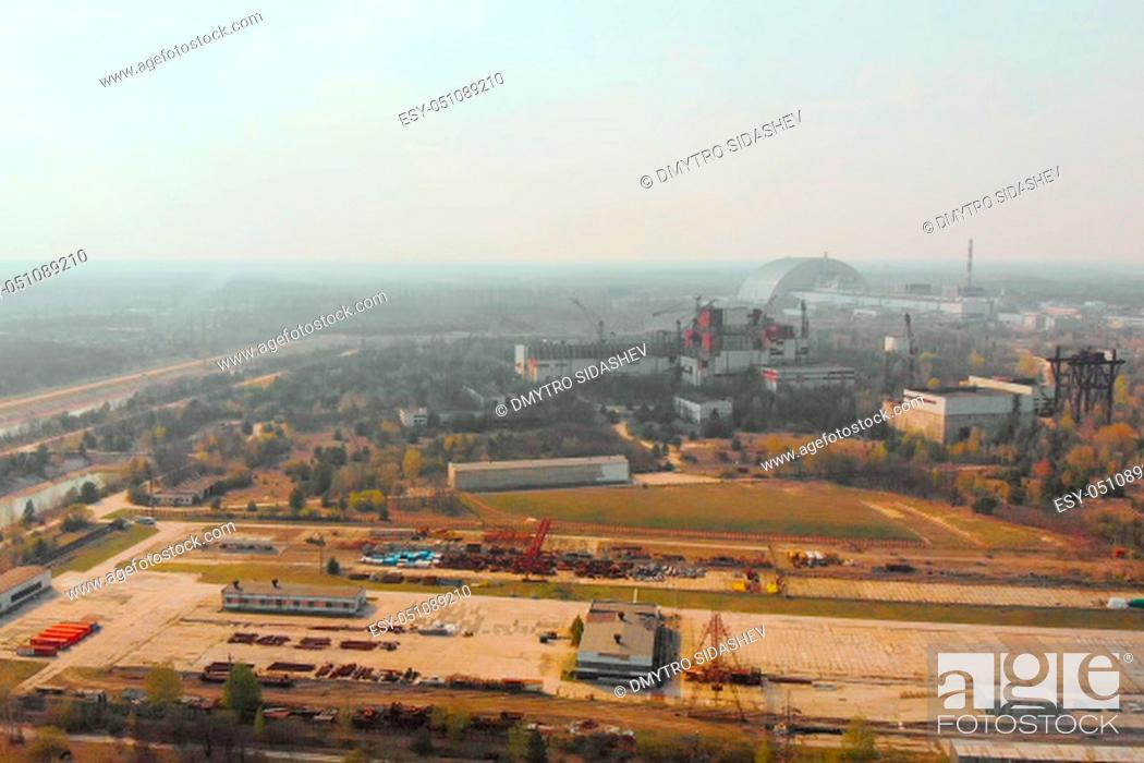 Stock Photo: Aerial view of the Chernobyl nuclear power plant, backward movement. Sarcophagus covers a nuclear power plant in Chernobyl destroyed by a nuclear explosion.