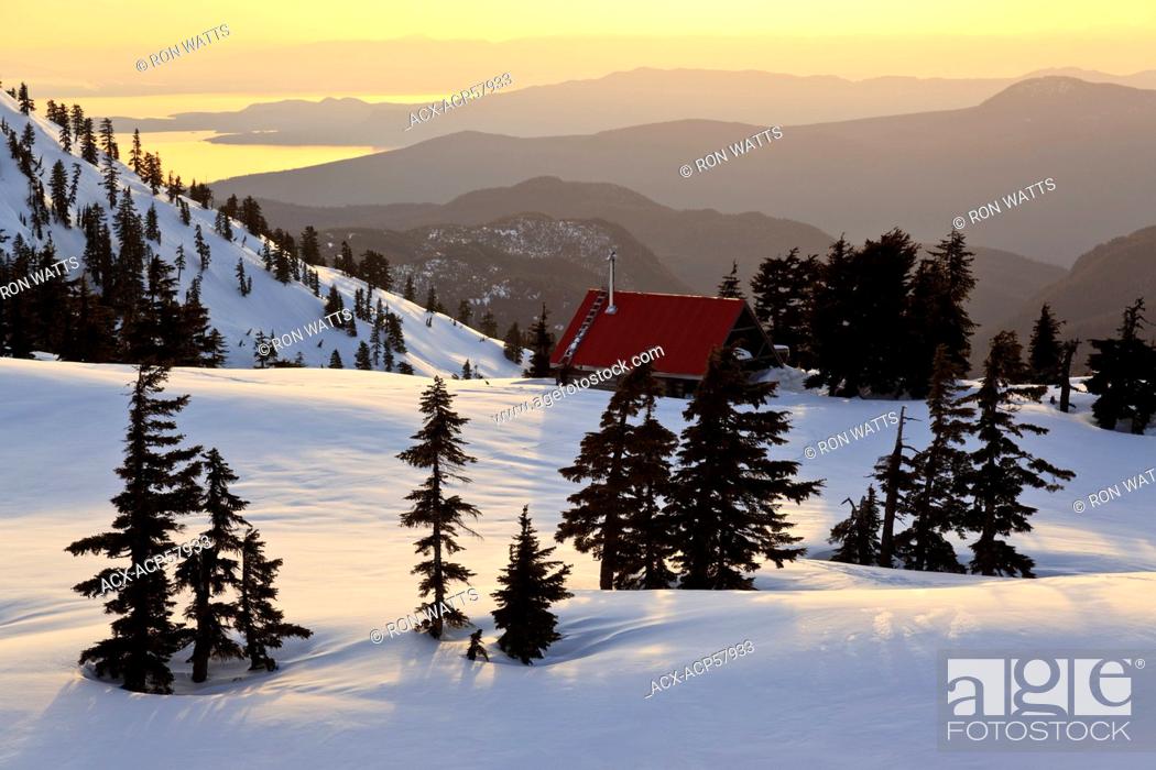 Stock Photo: The sun sets on Mt. Steele cabin in Tetrahedron Provincial park on the Sunshine Coast with the Strait of Georgia and Vancouver Island as backdrop.