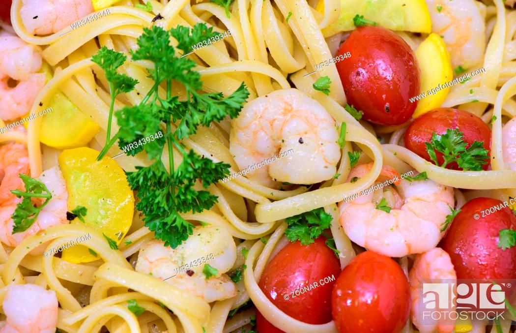 Stock Photo: mediterran italian pasta with prawns and tomatoes.