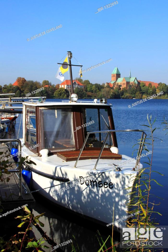 Stock Photo: Boat on Domsee Lake in front of Ratzeburg Cathedral and Herrenhaus, now the Regional Museum, on Dominsel island, Ratzeburg, Duchy of Lauenburg.