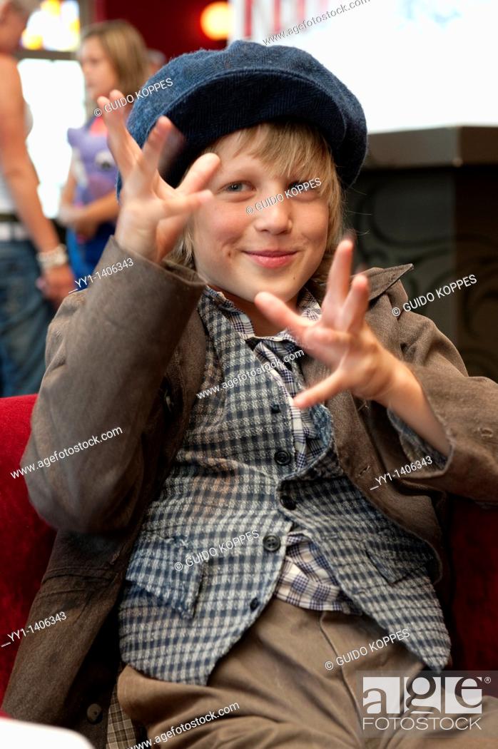Stock Photo: Kaatsheuvel, Netherlands. Young, caucasian boy, dressed up as the lead actor in the Dutch musical: ""Kruimeltje"", played out in The Efteling family amusement.