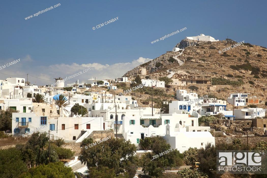Stock Photo: Whitewashed houses at the old town Chora or Chorio with the Zoodohos Pigi Monastery on the top of the hill at the upper side of the Kastro or Castle village.