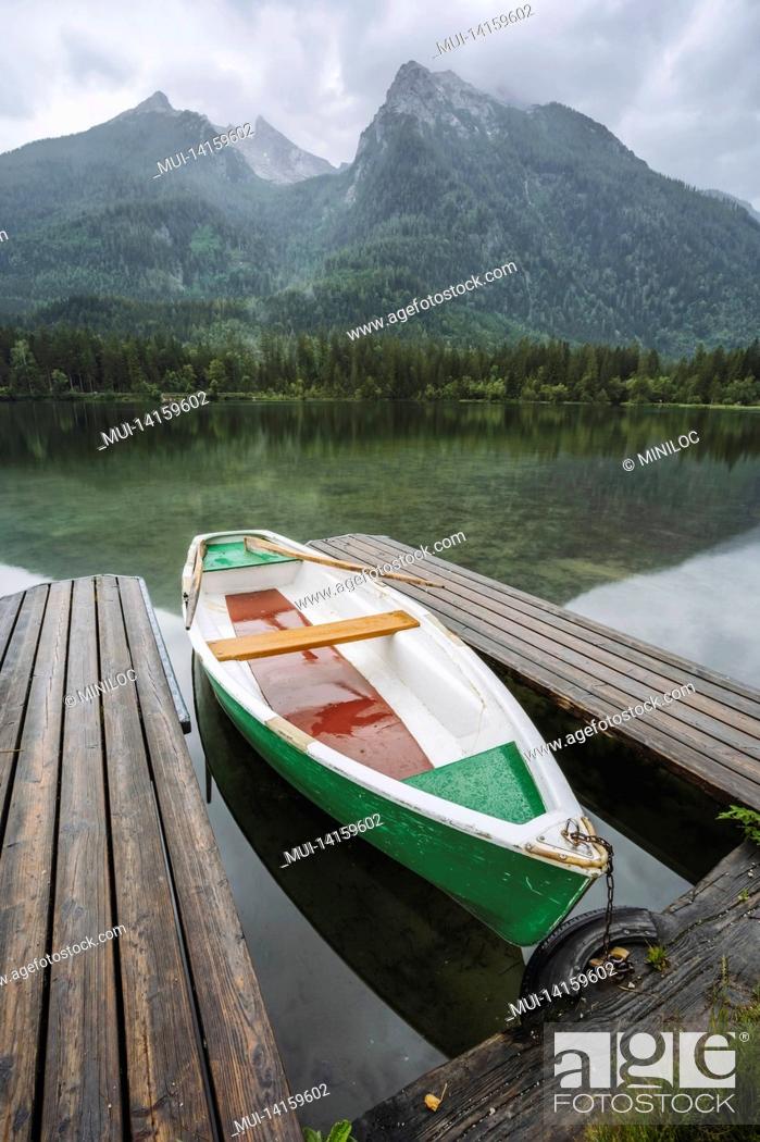 Stock Photo: pleasure boat at pier on hintersee lake with reflection of watzmann mountain peaks. ramsau berchtesgaden bavaria, germany, europe.