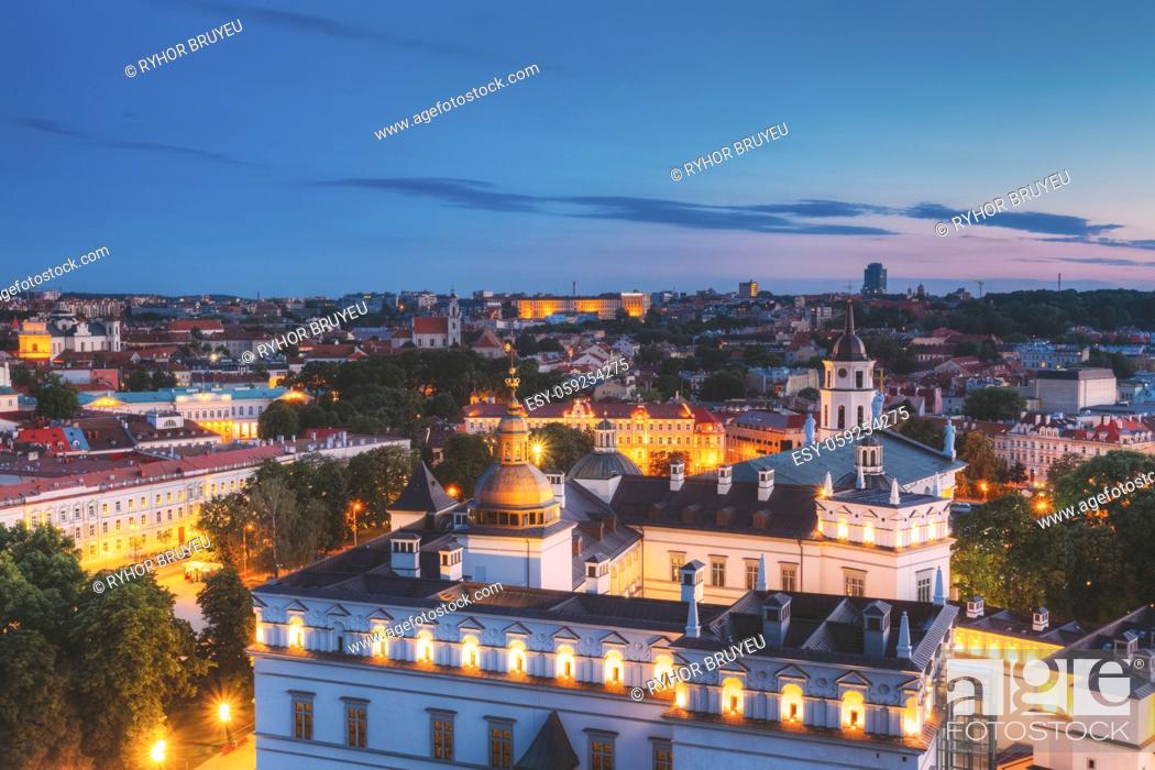 Stock Photo: Vilnius, Lithuania, Eastern Europe. Aerial View Of Historic Center Cityscape In Blue Hour After Sunset. Travel View Of Old Town In Night Illuminations.
