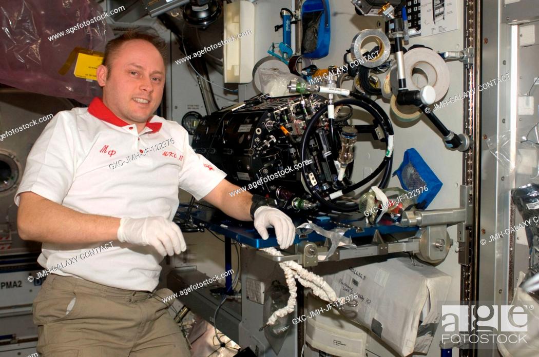 Stock Photo: Astronaut Michael Fincke, Expedition 18 commander, works on the Multi-User Droplet Combustion Apparatus (MDCA) Chamber Insert Assembly (CIA) in the Harmony node.