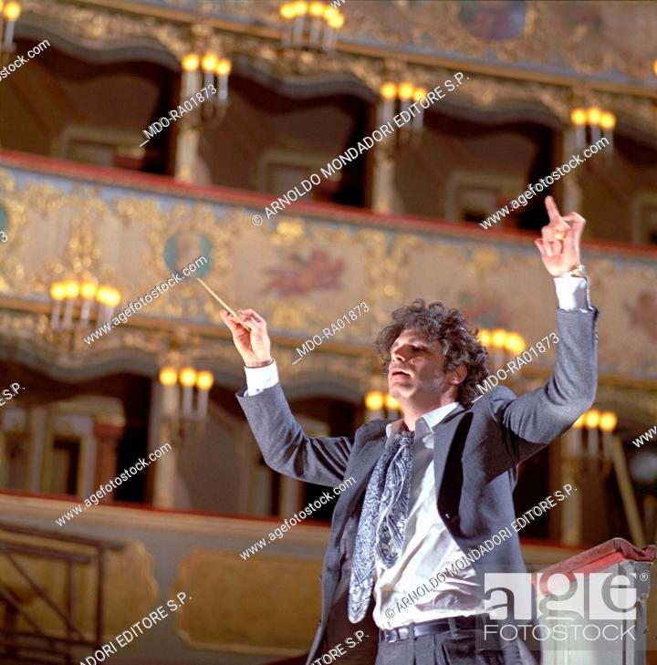 Stock Photo: American actor Tony Musante (Anthony Peter Musante) conducting the orchestra in a scene from the film The Anonymous Venetian. Venice, 1970.