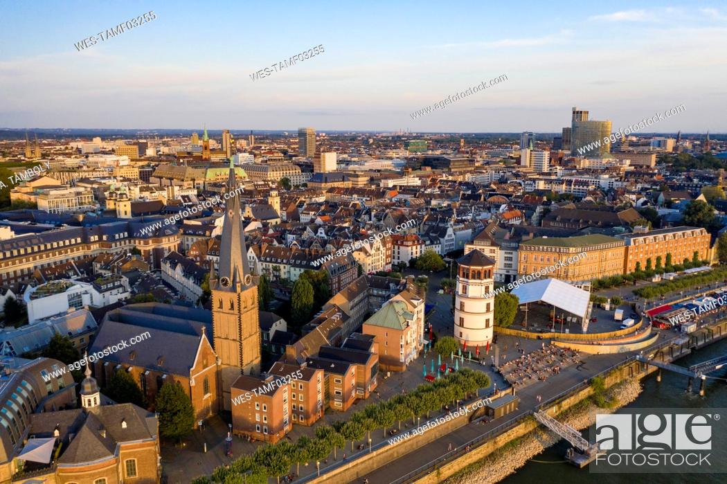 Stock Photo: Germany, North Rhine-Westphalia, Dusseldorf, Aerial view of Burgplatz, Schlossturm and Saint Lamberts Church at dusk.