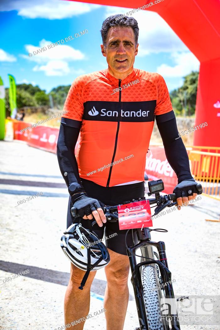 Stock Photo: Former cyclist Miguel Induráin at the end of the race in Madrid, Spain Jun 13, 2020. The former Tour de France winner cyclist competes in a MTB time trial in.
