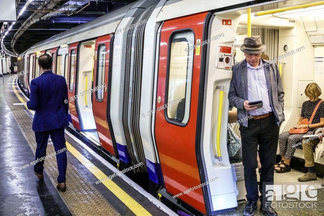 Imagen: United Kingdom Great Britain England, London, Embankment Underground Station, subway tube, public transportation, platform, man, passenger, commuter, train.