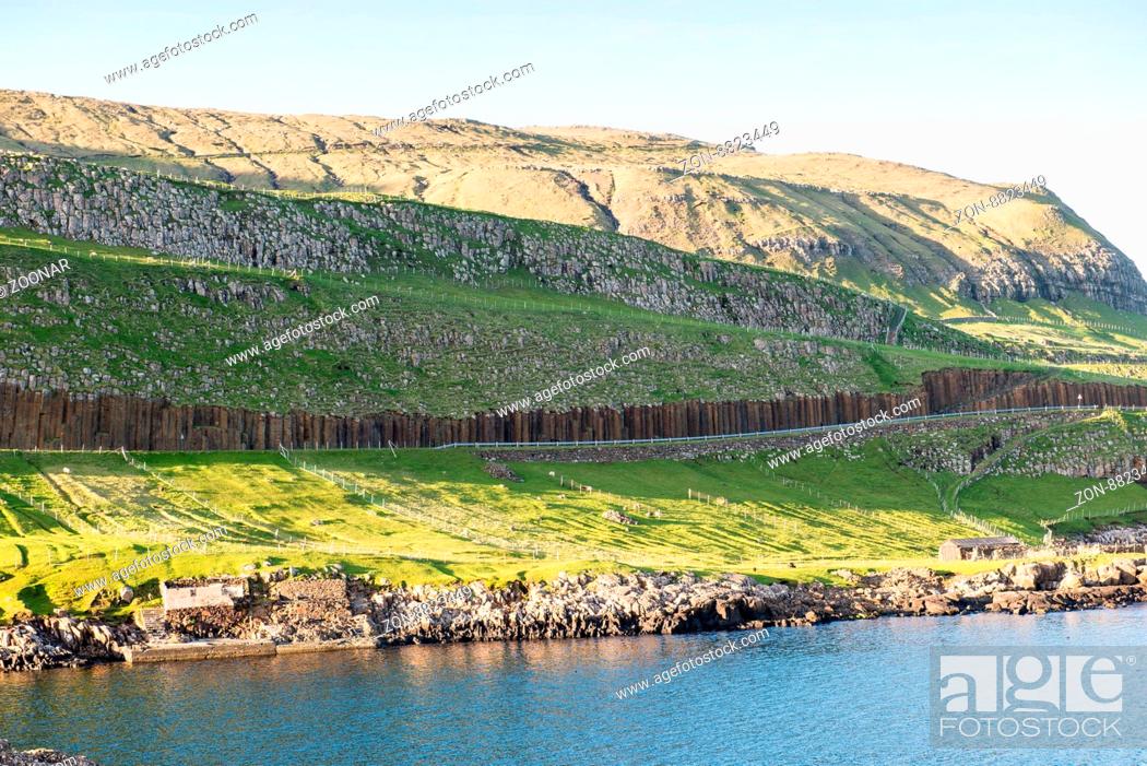 Stock Photo: Rote Basaltsäulen in Frodba auf den Färöer Inseln / Big red basalt columns on Suduroy on the Faroe Islands.
