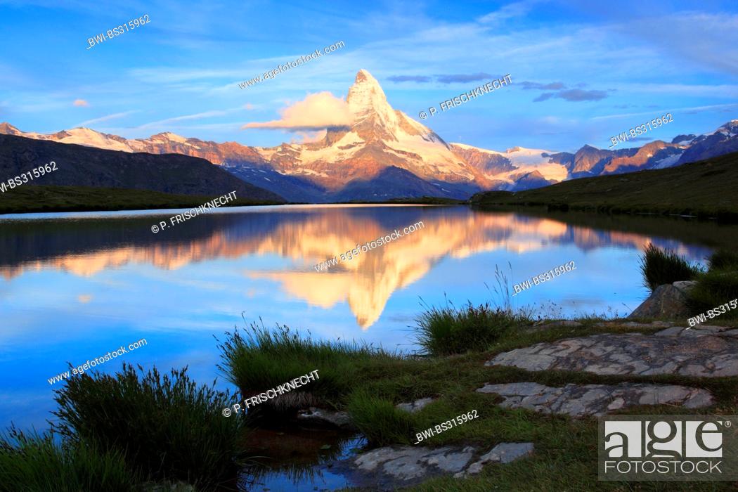 Stock Photo: Matterhorn mirroring in lake Stellisee at sunrise, Switzerland, Valais.