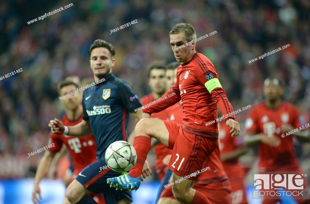 Stock Photo: Munich's Philipp Lahm (front) in action during the UEFA Champions League semi final second leg soccer match between Bayern Munich and Atletico Madrid at the.
