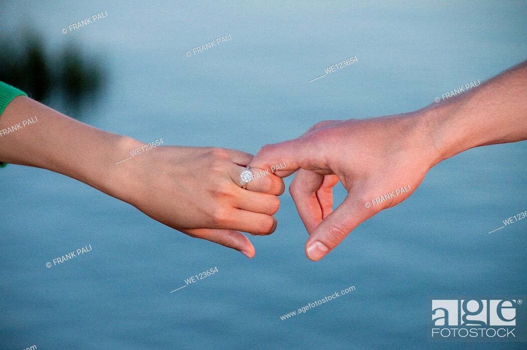 Stock Photo: Young couple holding hands.