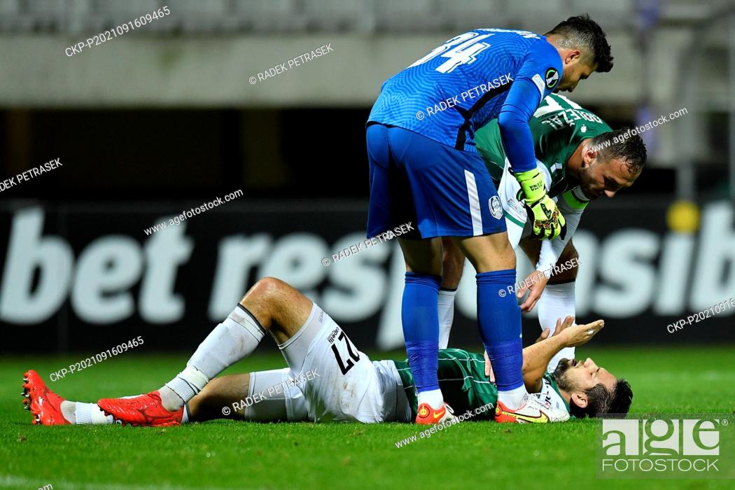 Stock Photo: From left goalie of Cluj Cristian Balgradean, Vojtech Kubista (on the ground), Martin Dolezal, both of Jablonec in action during the Football European.