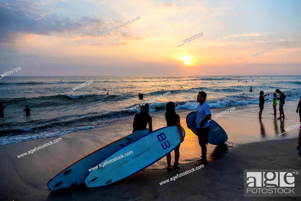 Stock Photo: Surfing at Sunset, Kuta, Bali, Indonesia.