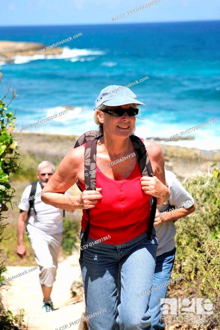Stock Photo: Woman hiking by the seaside.