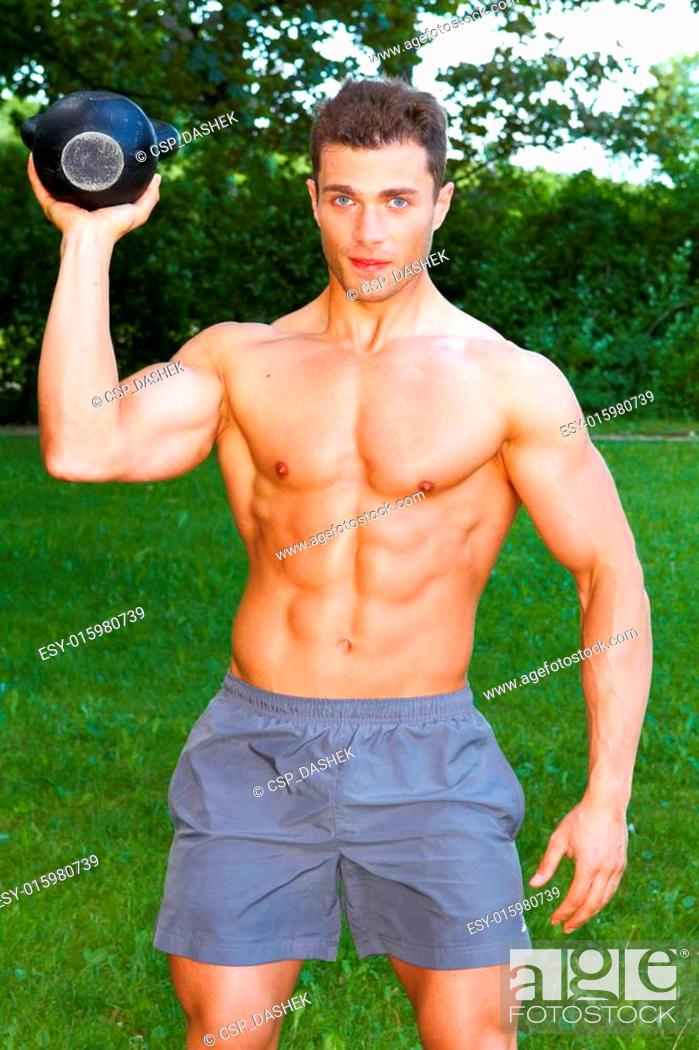 Stock Photo: Working with kettlebell at outdoor.