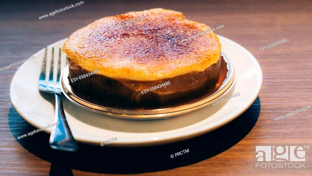 Stock Photo: Caramelized Baked Custards. Crème brulee. Vanilla Crème Brulee .popular Portuguese dessert. Leite Crème. Portuguese Custard Tarts.