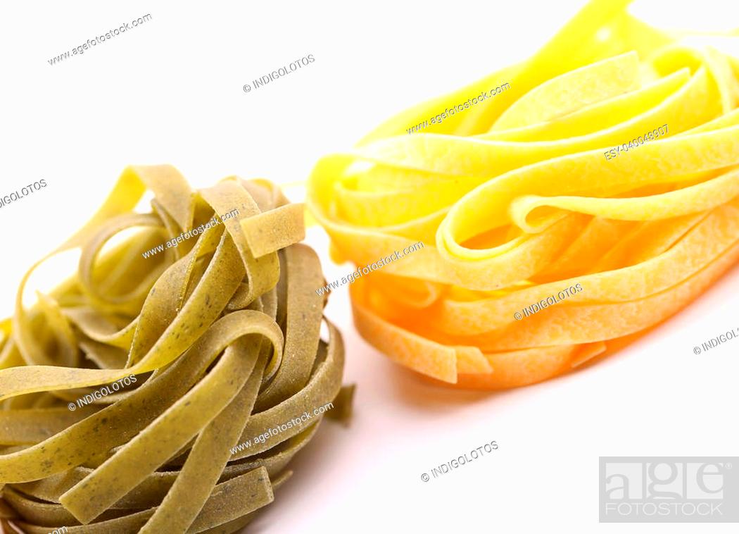 Stock Photo: Tagliatelle paglia e fieno tipycal italian pasta close-up on the white background.