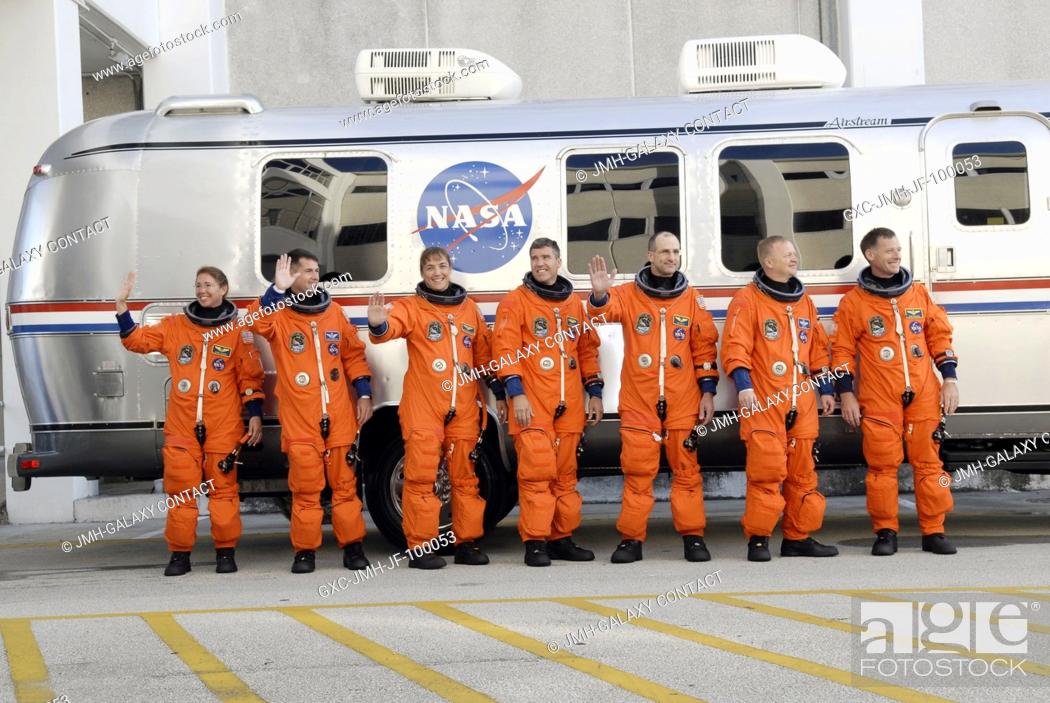 Stock Photo: After suiting up, the STS-126 crewmembers pause alongside the Astrovan to wave farewell to onlookers before heading for launch pad 39A for the launch of Space.