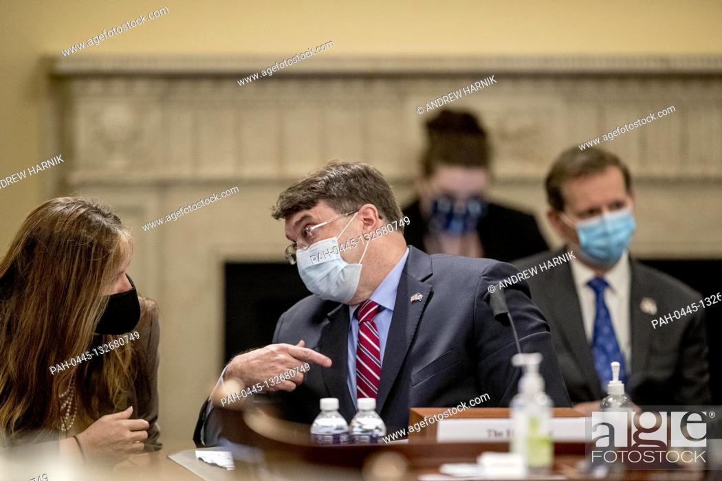 Stock Photo: United States Secretary of Veterans Affairs (VA) Robert Wilkie speaks to an aide as he appears before a US House Appropriations Subcommittee on Military.