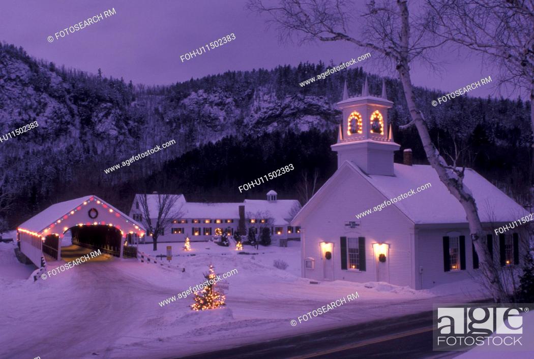 Stock Photo: covered bridge, church, NH, New Hampshire, Stark, Christmas lights decorate the Stark Union Church and covered bridge in the evening in winter.